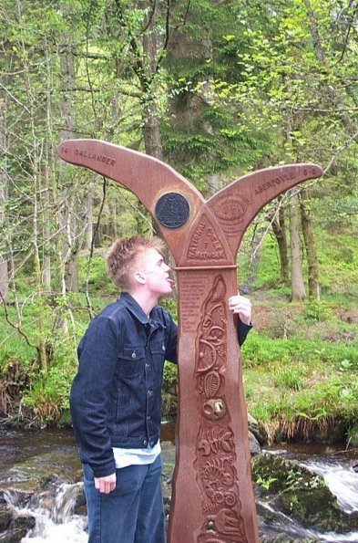 Myself and a milepost on the National Cycle Network