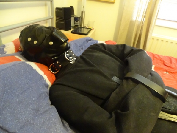 Totally helpless in the straitjacket!